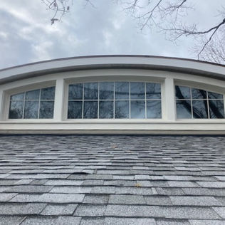 Custom dormer addition with arched windows completed in Guelph, Ontario