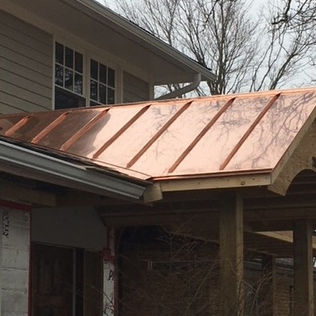 Copper standing seam roof installation in Guelph, Ontario