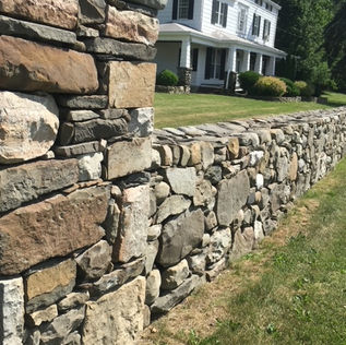 Natural stone retaining wall constructed in Guelph, Ontario